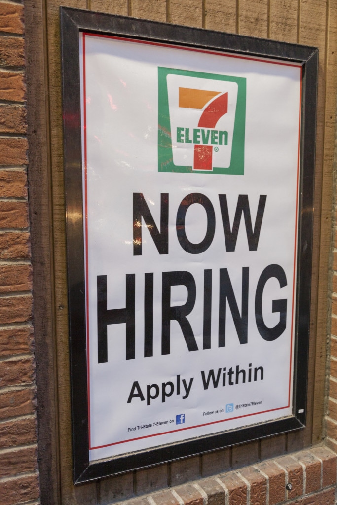Pittsburgh, Pennsylvania, USA March 30, 2012. Now Hiring sign in a 7 Eleven Shop. The Pennsylvania minimum wage is the same as the U.S. federal wage which is $7.25 an hour.
