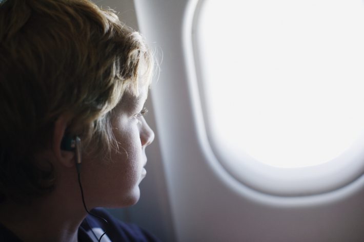Child-on-Plane-iStock-77188141-710x473