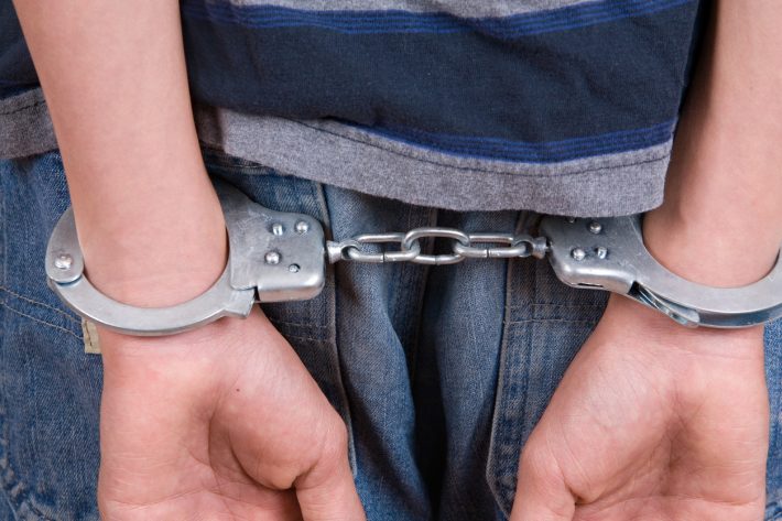 Kid-in-Handcuffs-iStock-174546155-710x473