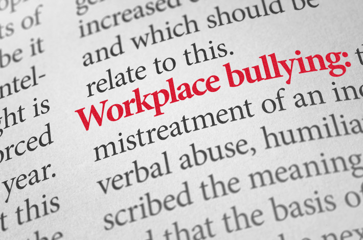 Definition of the term Workplace bullying in a dictionary