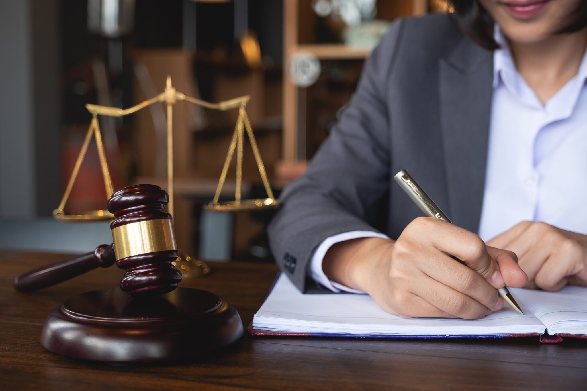Judge gavel with Justice lawyers, Business woman in suit or lawyer working on a documents. Legal law, advice and justice concept.