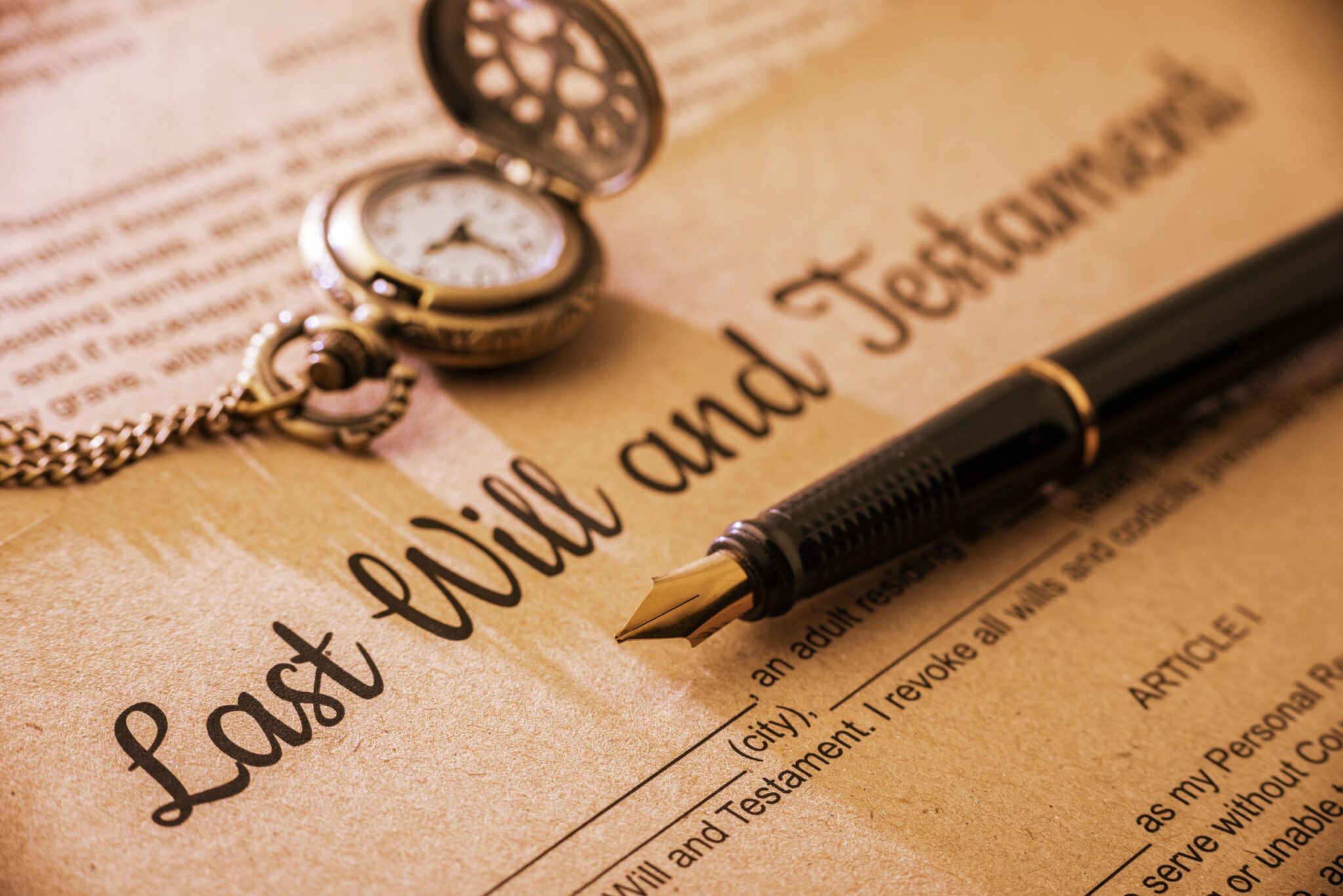 Vintage / retro style with a long shadow : Fountain pen, a pocket watch on a last will and testament. A form is printed on a mulberry paper and waiting to be filled and signed by testator / testatrix.