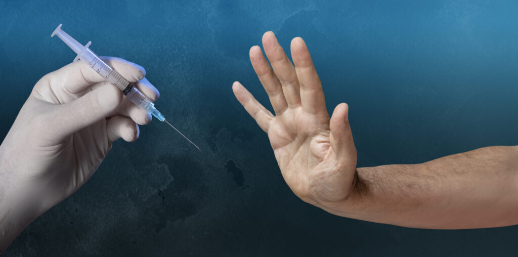 Man refusing to get injection of vaccine for Corona Virus Covid 19