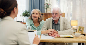 Estate Planning House, old couple and consultant with documents, retirement plan and conversation for budget advice. Financial meeting, man or woman in lounge, paperwork for legal agreement or will with investment