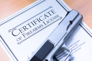 Handgun laying on a Gun / Firearms License Certificate Handgun laying on a Gun / Firearms License Certificate